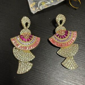Dangling big earrings for occasions. Brand new